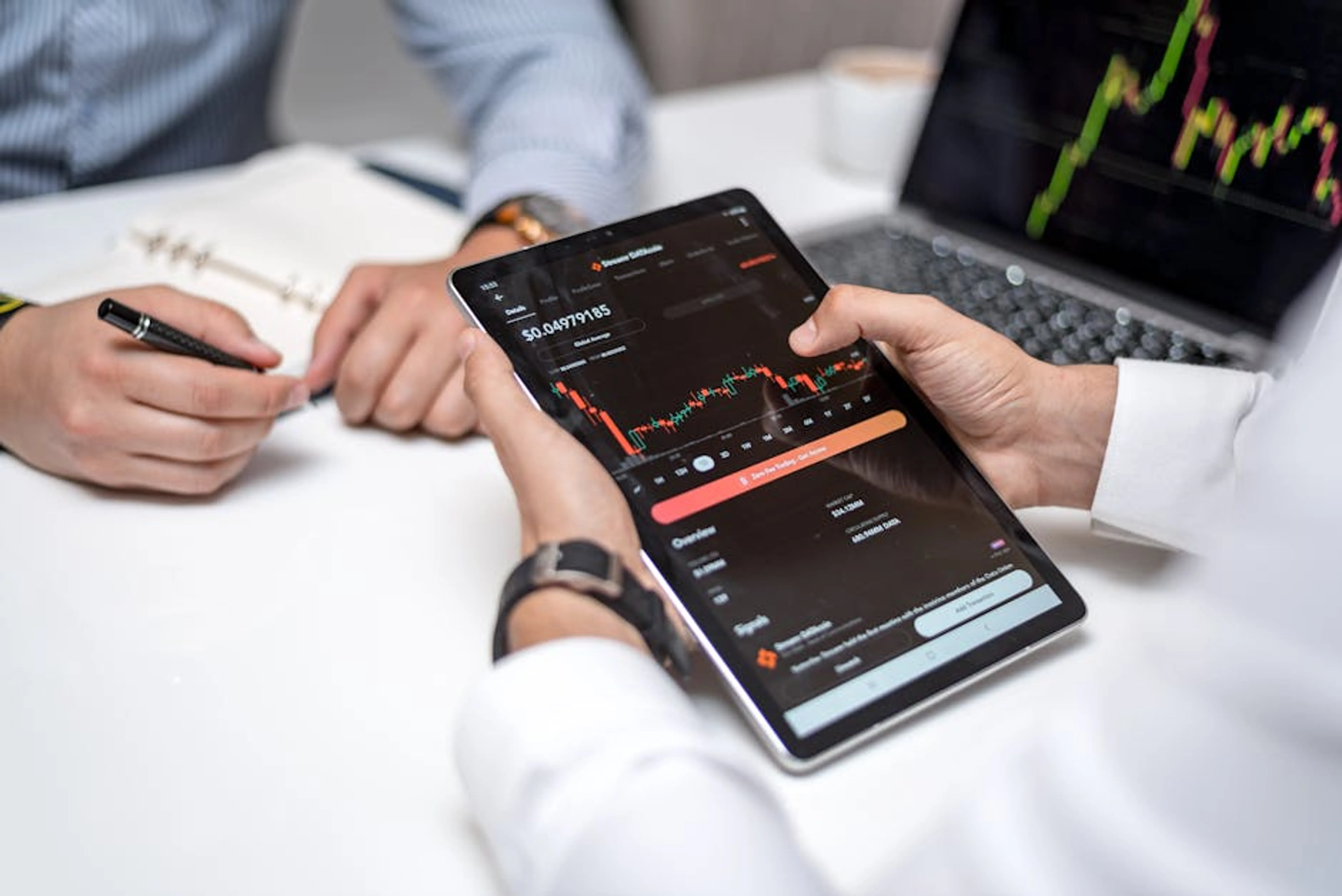 Professionals analyzing cryptocurrency data on a digital tablet during a business meeting. A graphic illustrating a data-driven decision-making process with data points leading to informed choices.