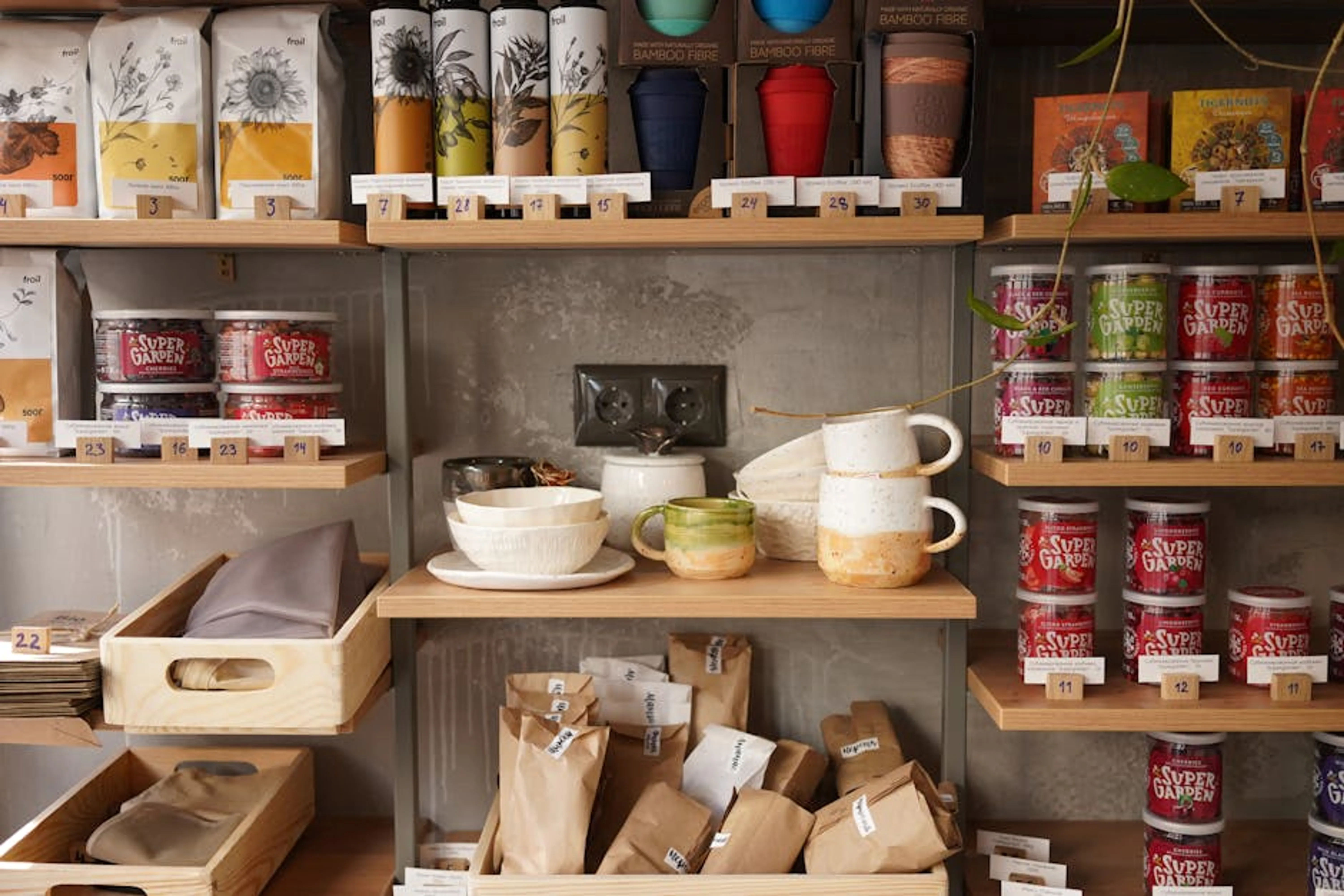 Rustic kitchen shelves displaying ceramics and food items, perfect for home decor inspiration. Neatly organized pantry shelves with labeled containers