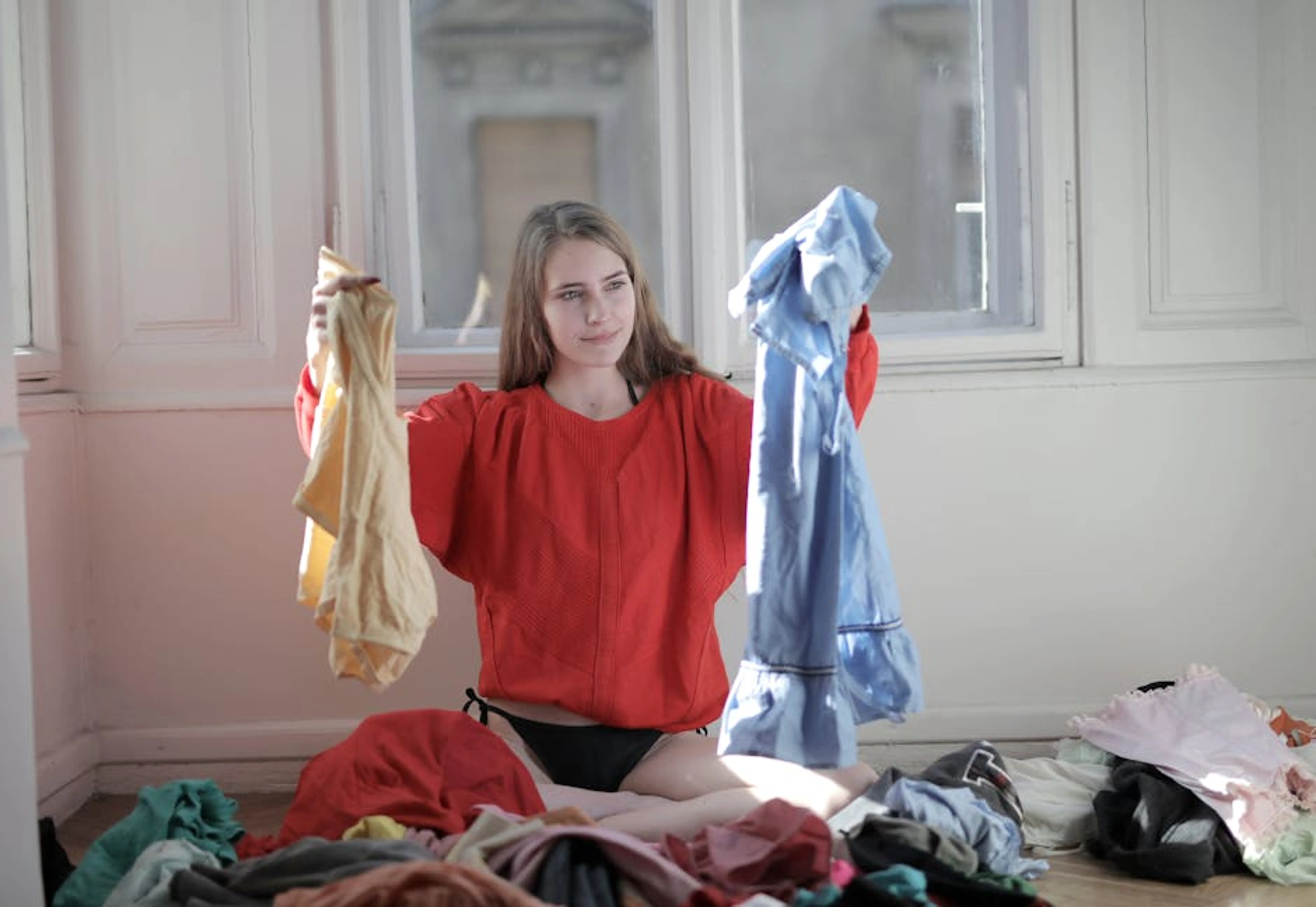 A woman in a red sweater deciding between clothes in a messy room. A person meditating in a peaceful setting, symbolizing thoughtful choice in yoga practice.